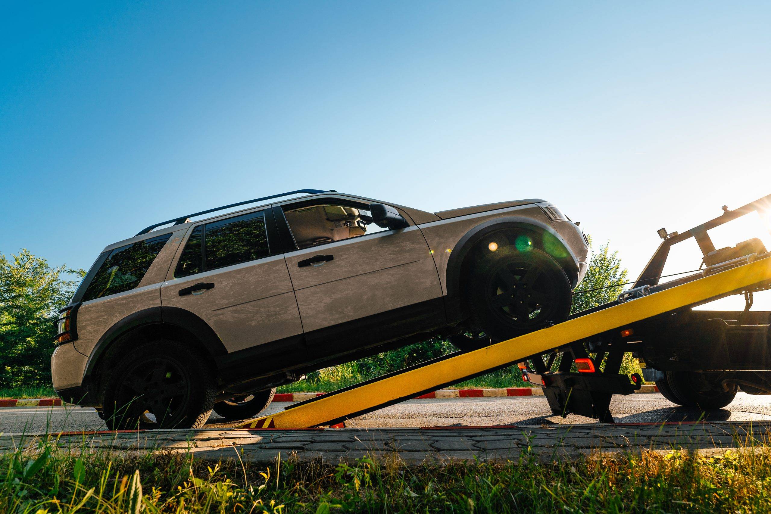 Broken Car On Tow Truck